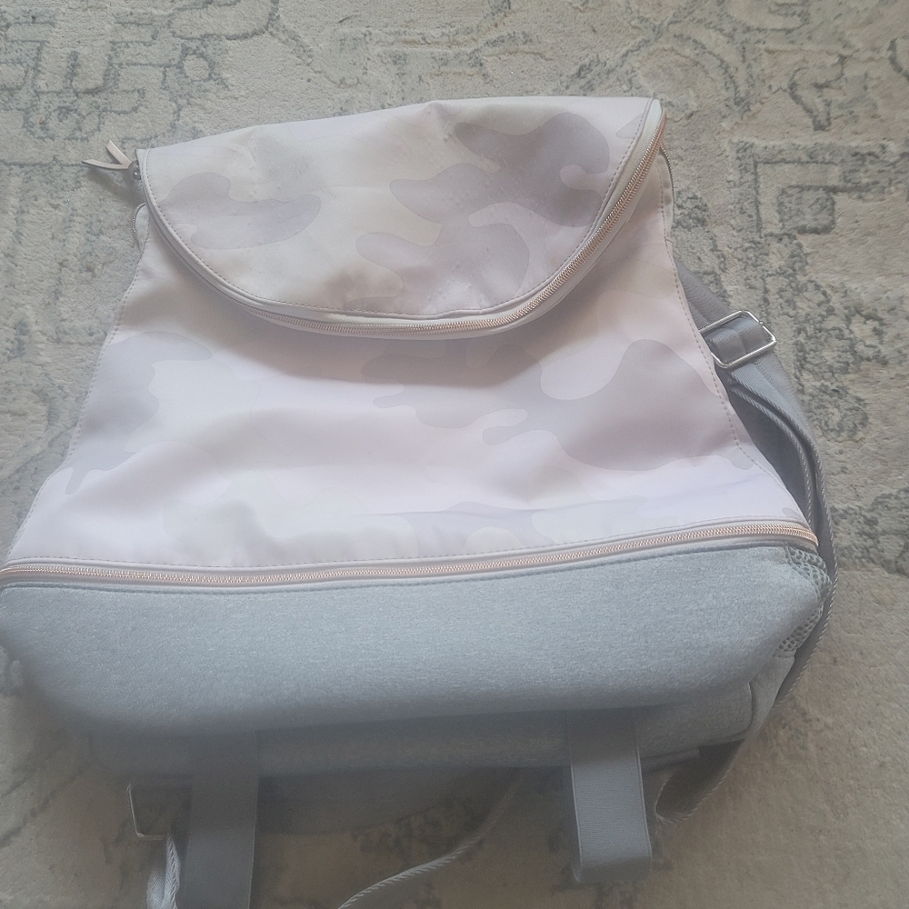 StellaDot camouflage backpack purse. Has a zipper bottom. Lots of room.